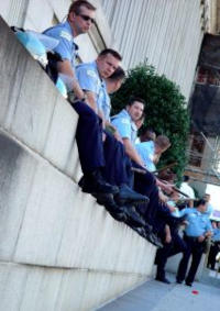 cops sit on wall
